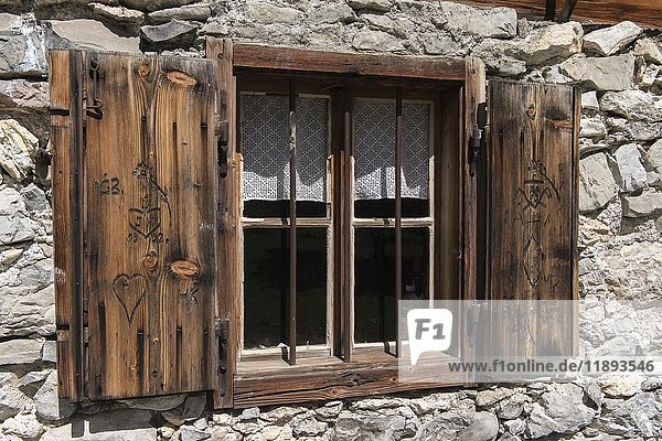 Window with wooden carvings at an alpine cabin  Engalm  Karwendel  Tyrol  Austria  Europe