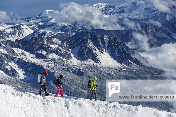 Three Climbers on snowy ridge of Mont Blanc  Chamonix  France  Europe