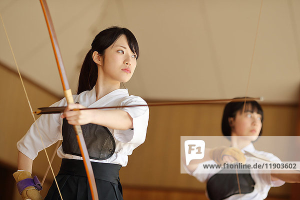 Japanese traditional archery athletes practicing