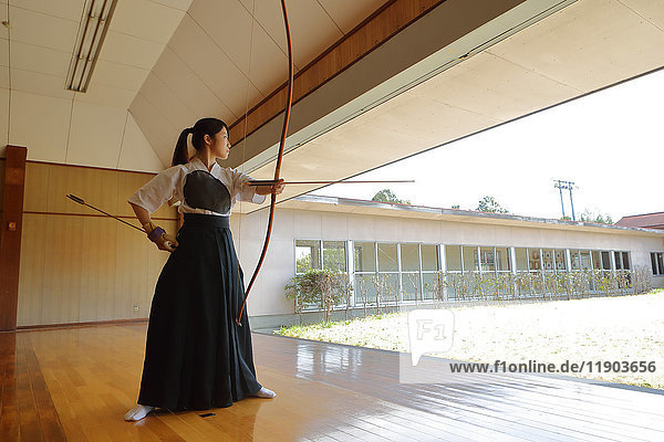 Japanese traditional archery athlete practicing