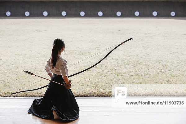 Japanese traditional archery athlete practicing