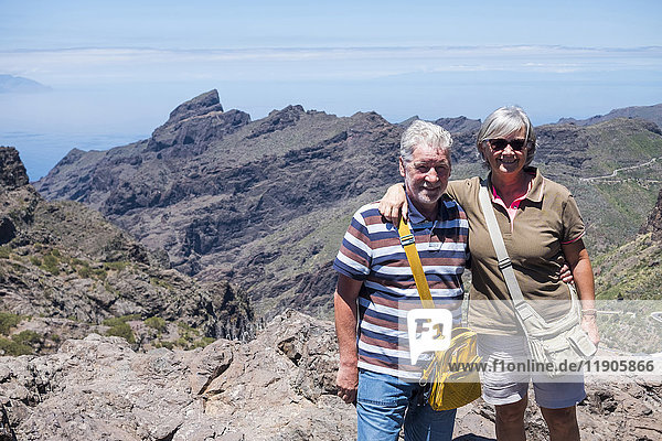 Portrait of smiling older Caucasian couple on mountain