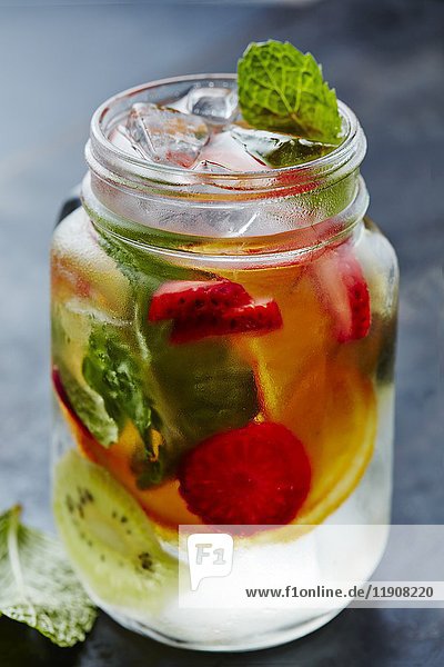 Water with fresh fruits  ice cubes and mint
