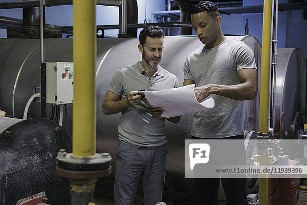 Men working in industrial setting