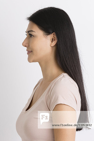Profile of smiling dark-haired woman