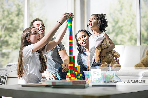 Family playing with building blocks