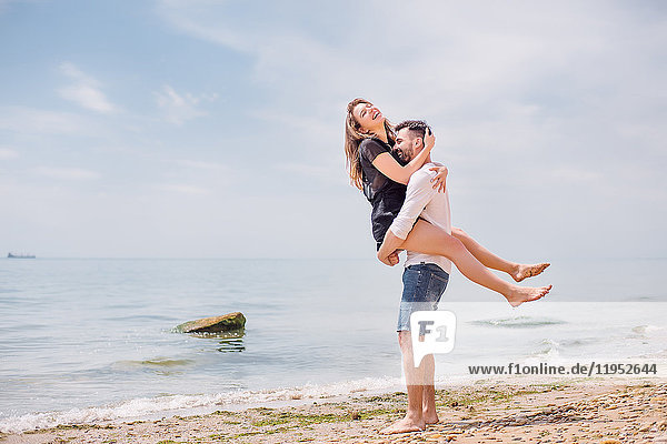 Couple on beach  Odessa  Ukraine