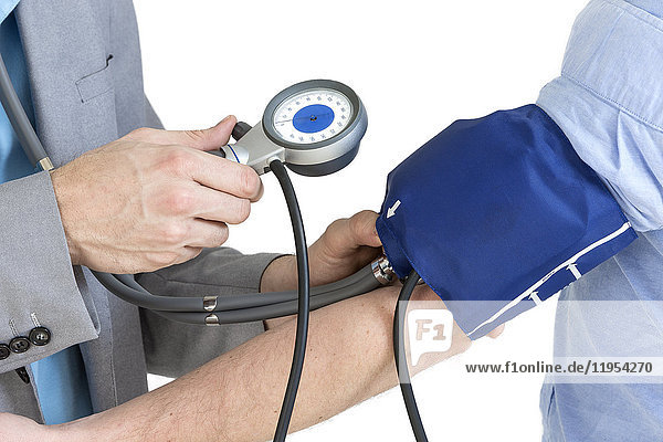 Close Up Of A Doctor Checking Blood Pressure Of A Patient on white background