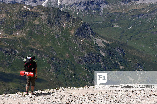 French Alps. Mont Blanc Massif. Walker on a path above the Chamonix Valley  France.
