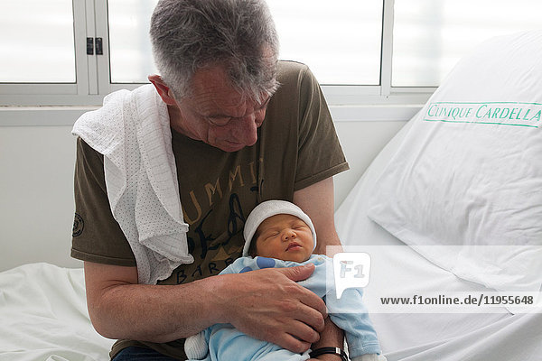 Reportage on a mainland French couple having recourse to a fa’a’amu adoption in Tahiti. Lea and her adoptive father at the maternity clinic.