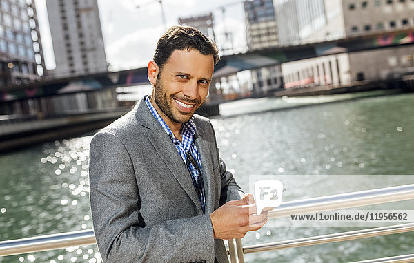 Portrait of a smiling businessman in the city
