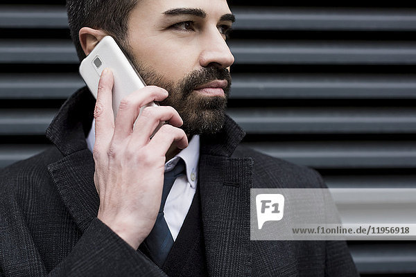 Close-up of businessman on cell phone