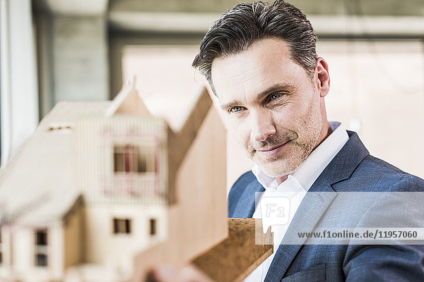 Architect working on architectural model