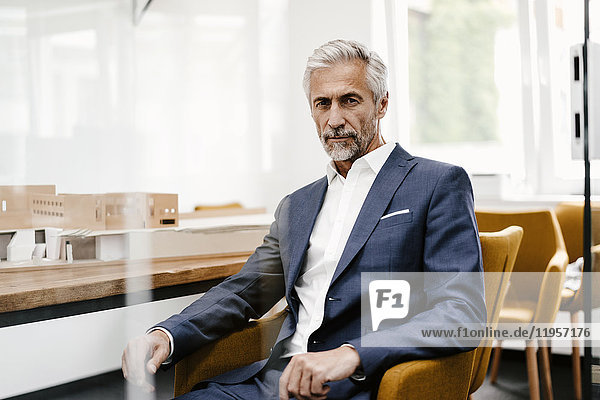 Portrait of confident mature businessman in office