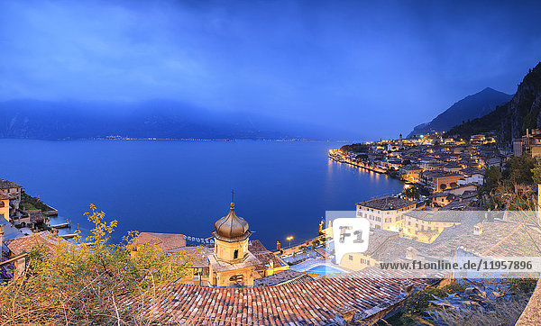 Panorama of Lake Garda and the typical town Limone Sul Garda at dusk province of Brescia Italian Lakes Lombardy Italy Europe