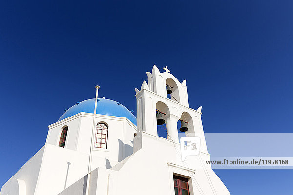 Classic Greek Orthodox church with blue dome Oia Santorini Cyclades Greek Islands Greece Europe