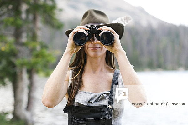 Woman using binoculars