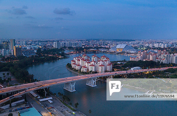 Elevated cityscape with highway bridge and apartment developments at dusk  Singapore  South East Asia