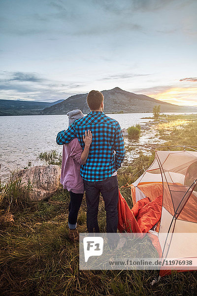 Couple standing beside tent  looking at view  Heeney  Colorado  United States