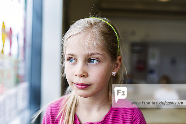 Girl (8-9) in classroom