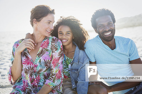 Portrait smiling  multi-ethnic family on sunny summer beach