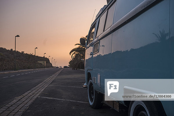 Spain  old van parking at roadside by sunset