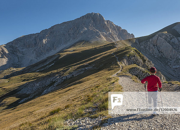 Italy  Abruzzo  Gran Sasso e Monti della Laga National Park  boy on hiking trail of Corno Grande