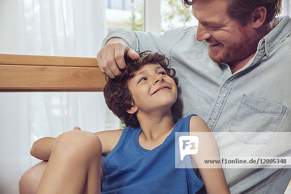 Father tickling son?s head