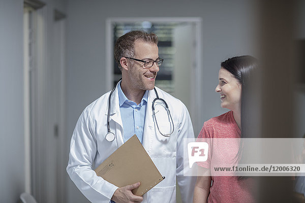 Doctor smiling at patient in medical practice