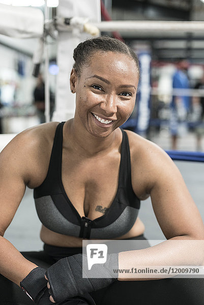 Black woman with wrapped hands in gymnasium
