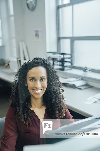 Portrait of smiling mixed race businesswoman
