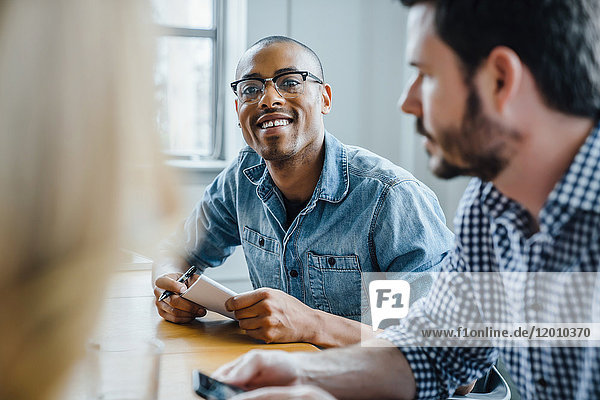 Businessman listening in meeting