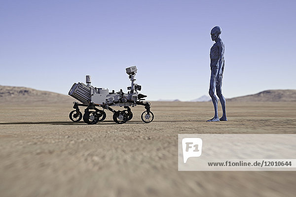Alien beobachtet kleines Fahrzeug in der Wüste