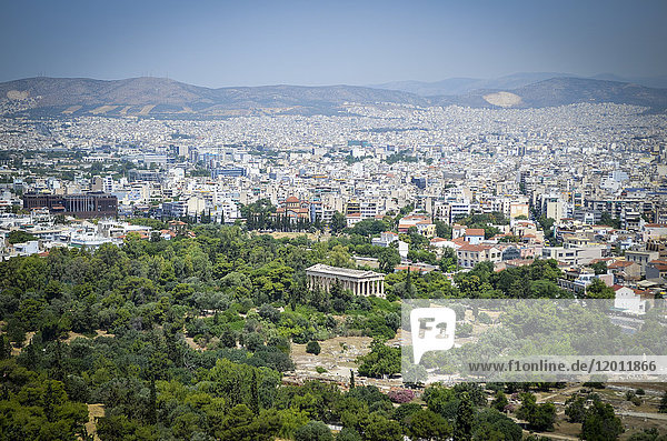Cityscape of Athens  Greece  with the Parthenon in the foreground.
