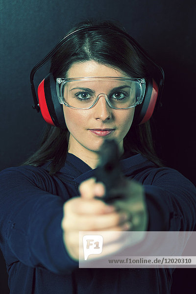 France  young woman with a gun.