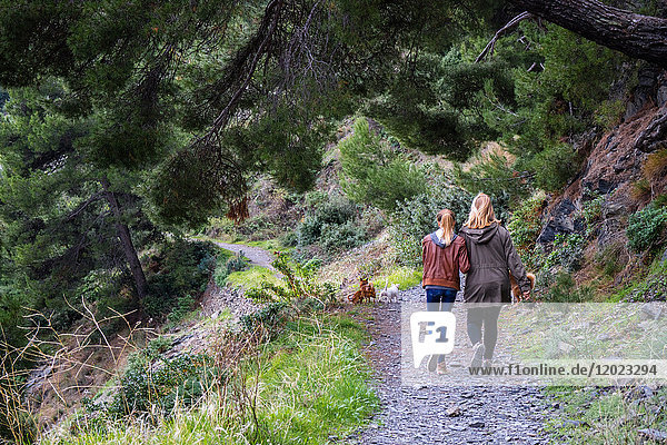 France Var Mother and daughter walking view from the back