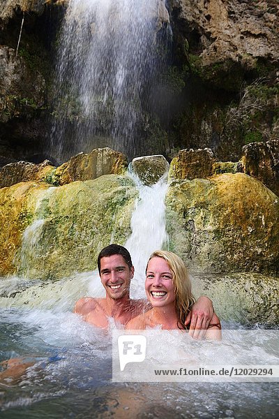 Couple bathing in Main Hot Springs  Wadi Main  Madaba  Jordan  Asia