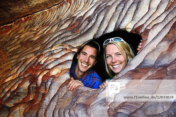 Tourists pose at colourful rock-formations in Petra  Wadi Musa  Jordan  Asia