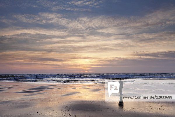 Woman at Praia da Borderia beach at sunset  Carrapateira  Costa Vicentina  West coast  Algarve  Portugal  Europe