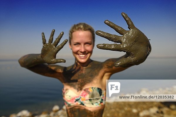 Young woman uses Clay of Dead Sea for cleaning skin  Jordan  Asia
