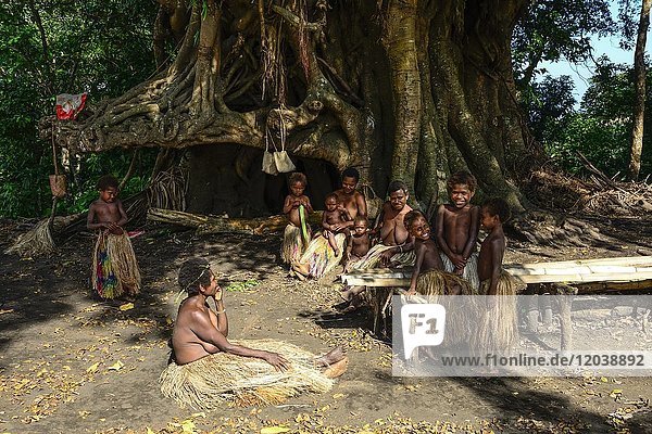 Native women and children sitting together  Yakeel Custom Village  Tanna Island  Vanuatu  South Sea  Oceania