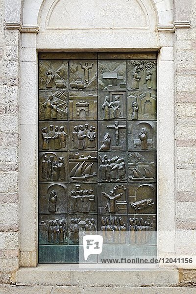 The door of Saint Mary's church depicting the life of Blessed Osanna of Cattaro  Kotor  Montenegro  Europe