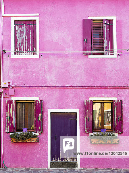 Detail of colourful painted building island of Burano Venice Veneto Italy Europe