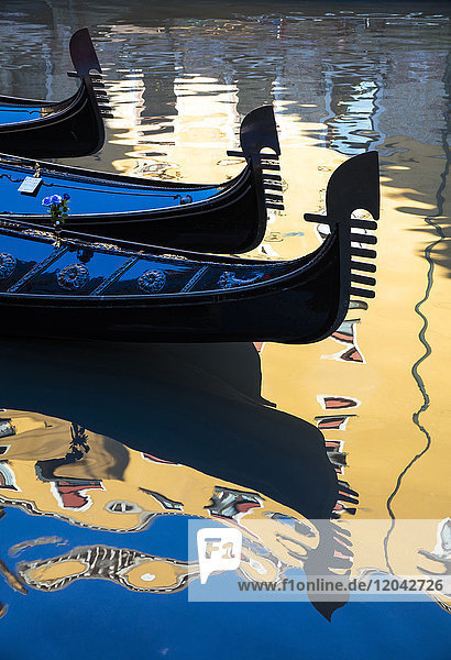 Gondolas and reflections Gondole Bacino Orseole near St. Mark's Square Venice UNESCO World Heritage Site Veneto Italy Europe