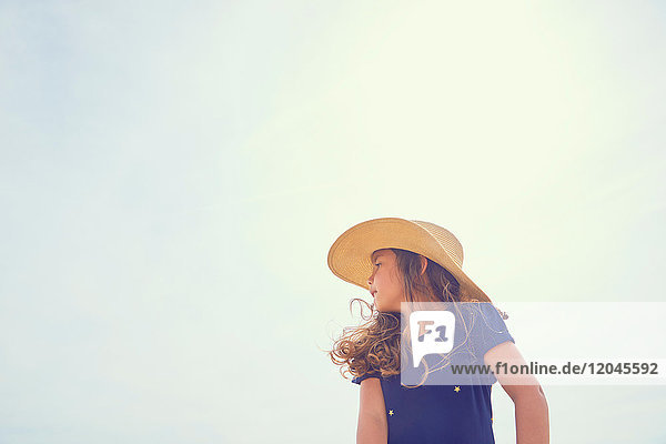 Young girl  outdoors  looking away  low angle view