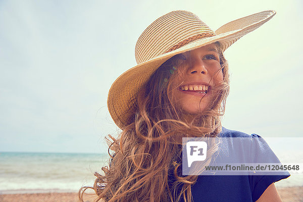 Portrait of young girl on beach  smiling