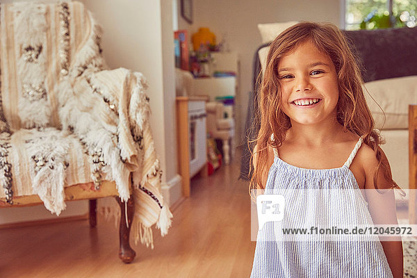 Portrait of young girl at home  smiling
