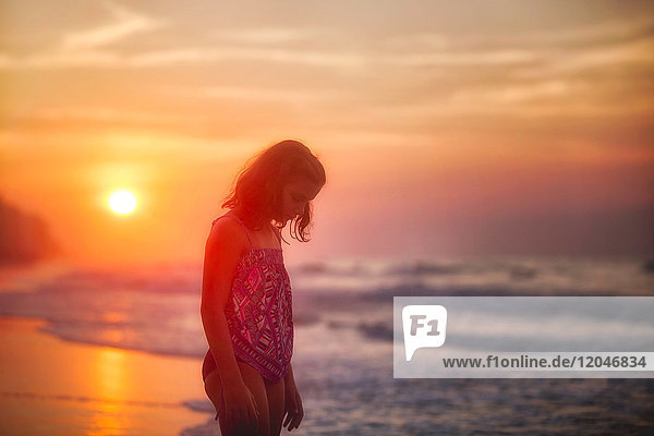 Girl on beach at sunset  North Myrtle Beach  South Carolina  United States