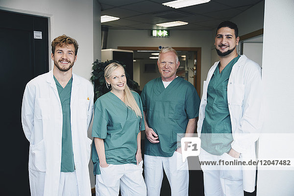 Portrait of multi-ethnic medical coworkers standing at hospital