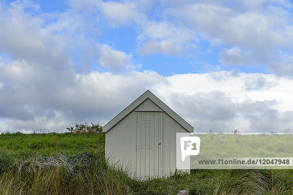 Fisherman's hut on the dune heath at the beach in Bamburgh in Northumberland England United Kingdom